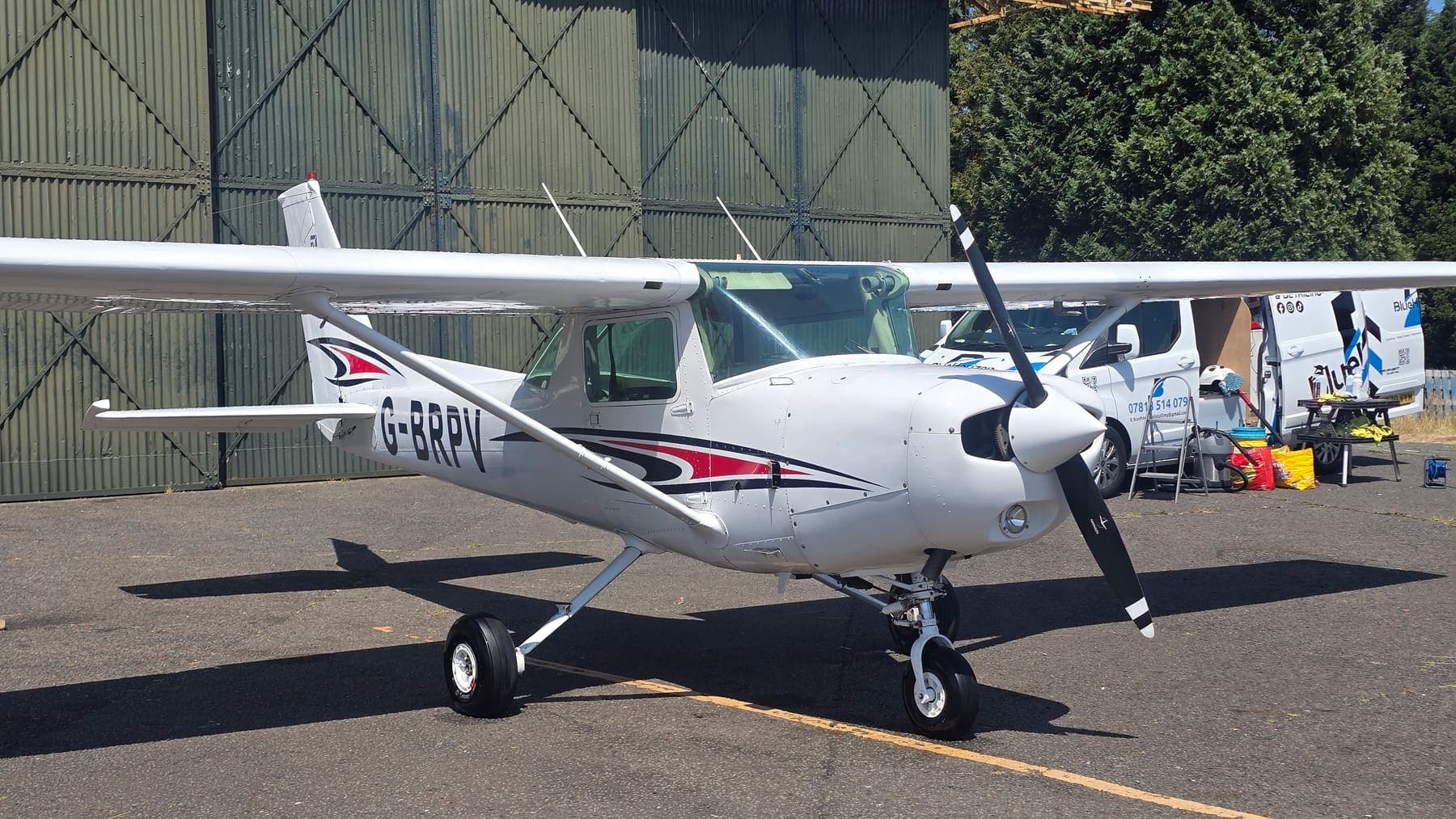 A freshly detailed Cessna 152 parked on the apron after a fleet wash visit