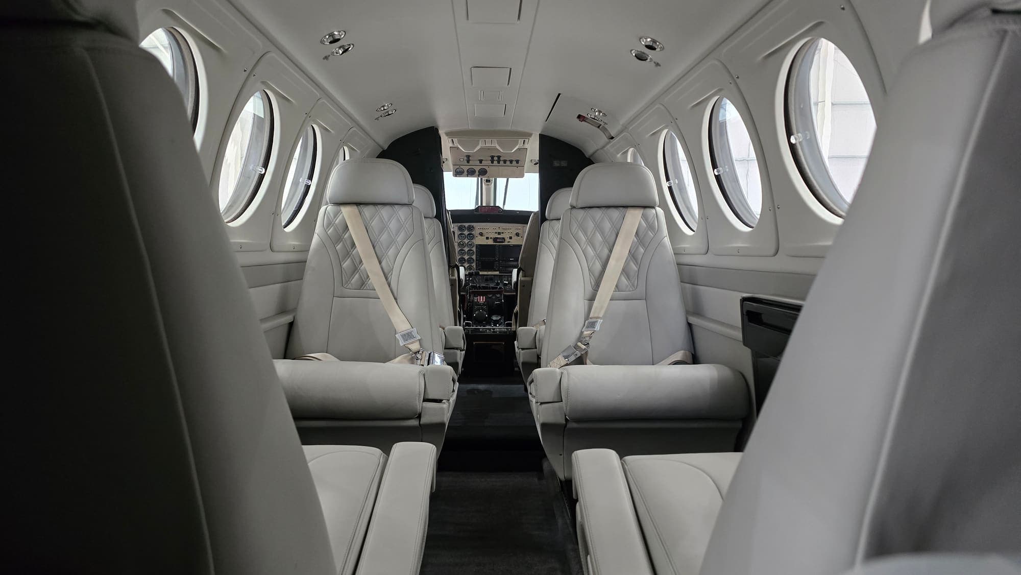 King Air cabin after a full interior clean — quilted leather club seats, spotless carpet and trim